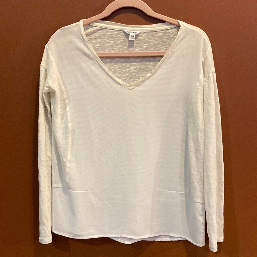 Calvin Klein ladies blouse in size small.  Cream coloured with long sleeves.